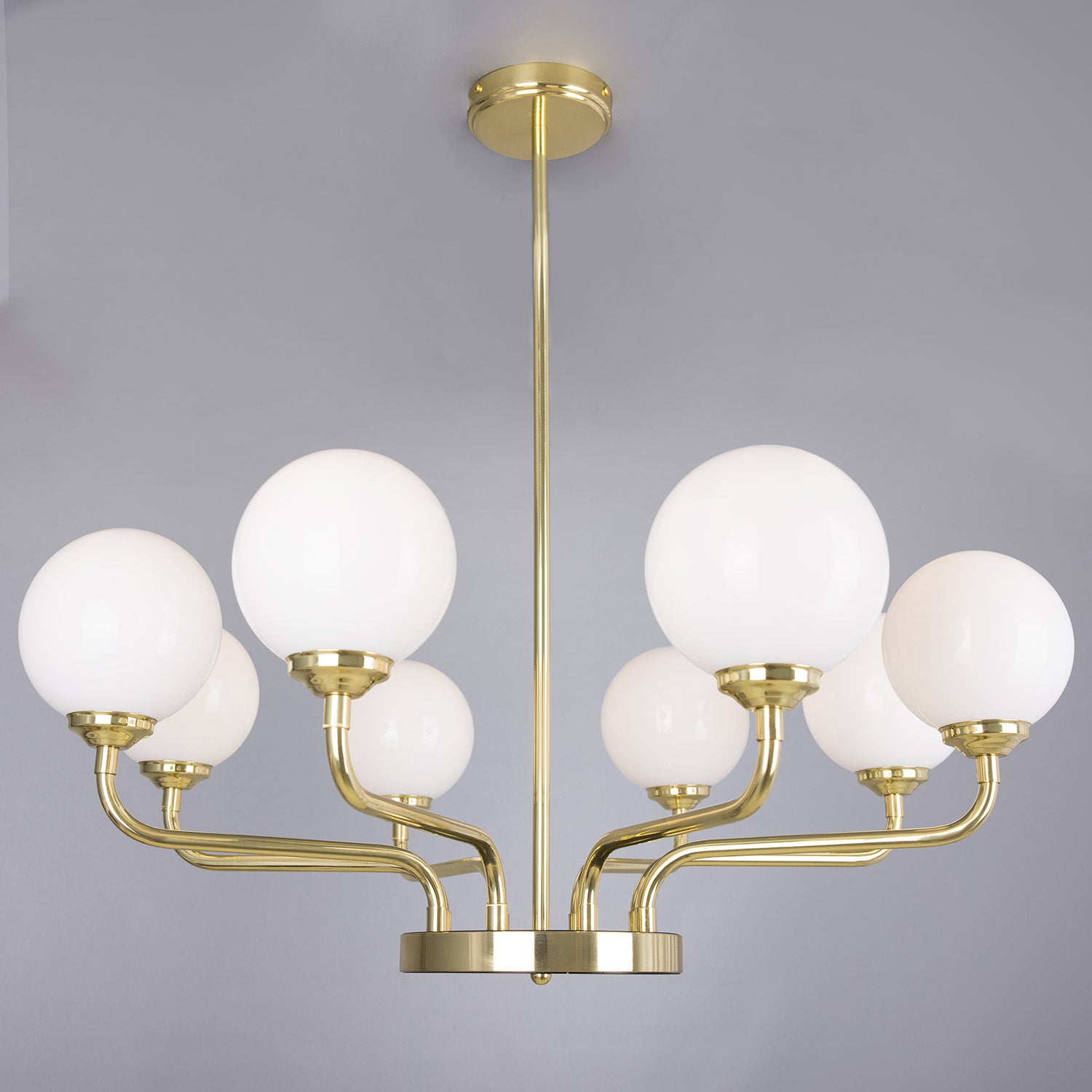 Branford Opal Globe Chandelier by Mullan Lighting with multiple opal glass globes, elegant chandelier design, and warm ambient lighting for sophisticated interiors