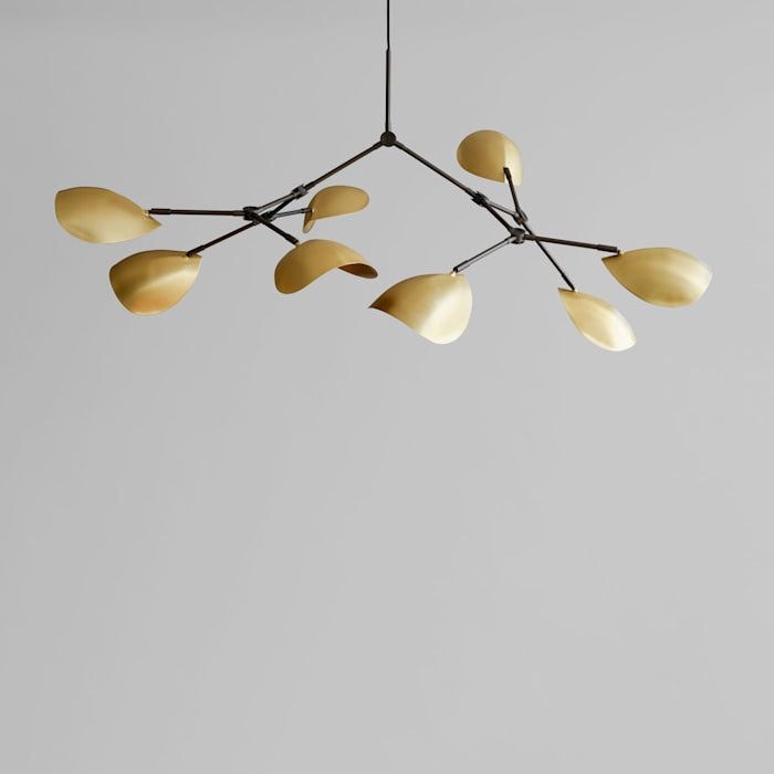 Stingray Chandelier by 101 Copenhagen with sweeping, organic arms and sculptural metal shades, ideal for modern artistic spaces.

