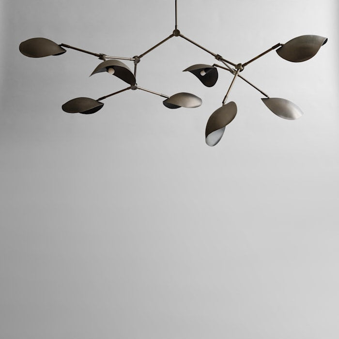 Stingray Chandelier by 101 Copenhagen with sweeping, organic arms and sculptural metal shades, ideal for modern artistic spaces.

