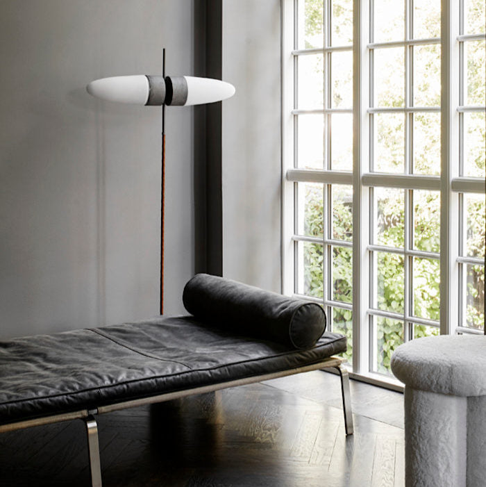Bull Floor Lamp by 101 Copenhagen with its signature horn-shaped silhouette and twin opal glass shades standing tall in a contemporary interior.
