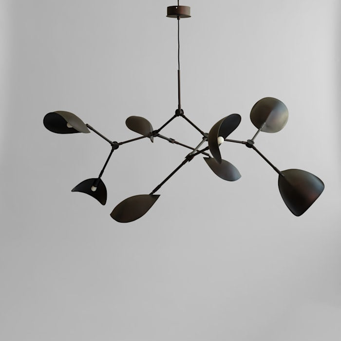 Stingray Chandelier by 101 Copenhagen with sweeping, organic arms and sculptural metal shades, ideal for modern artistic spaces.

