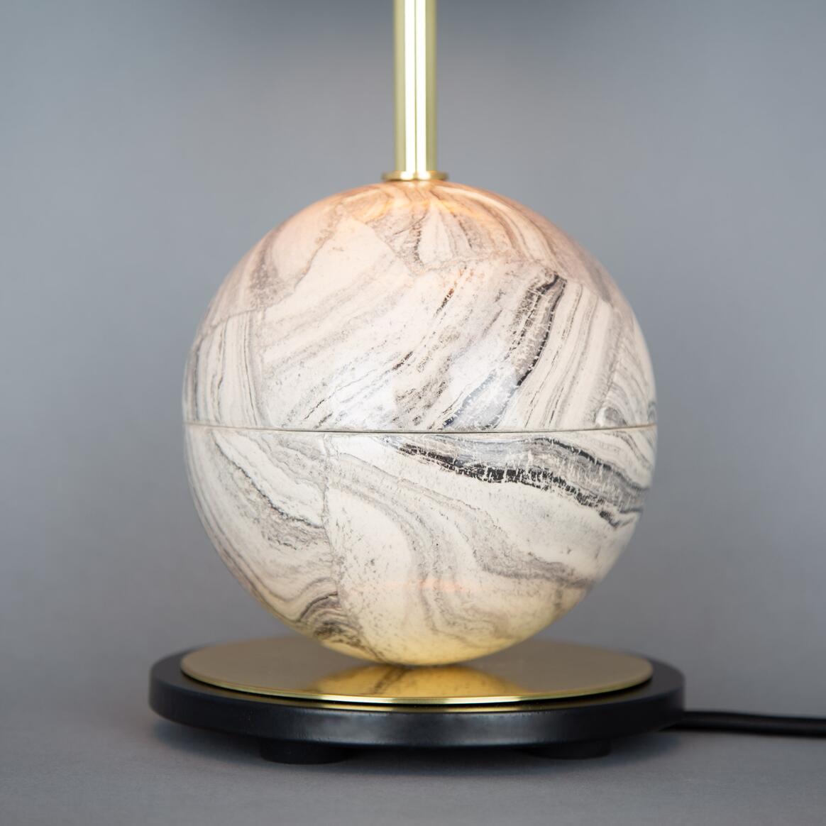 Marble-textured globe lamp with gold accents on a gray background