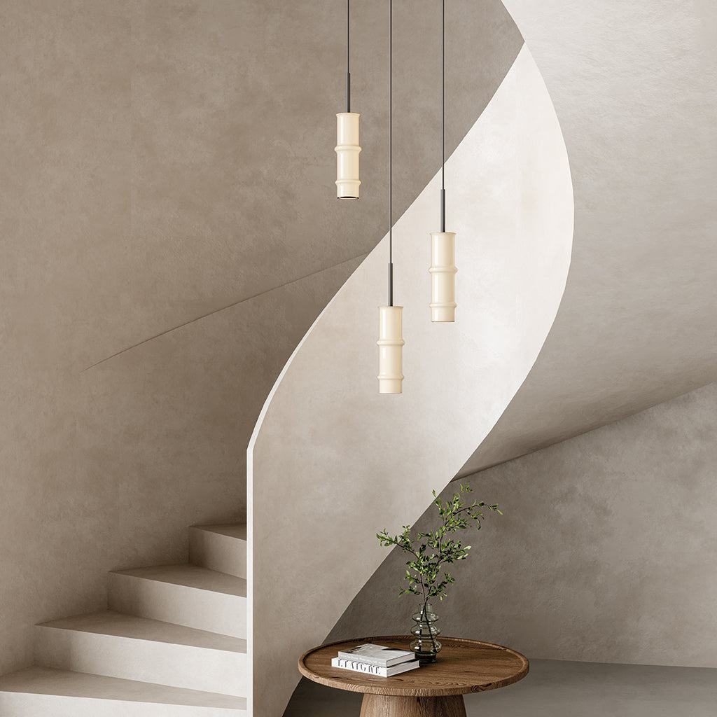 Canna Pendant Lamp by Aromas del Campo with sleek cylindrical design and warm ambient lighting for modern interior spaces.