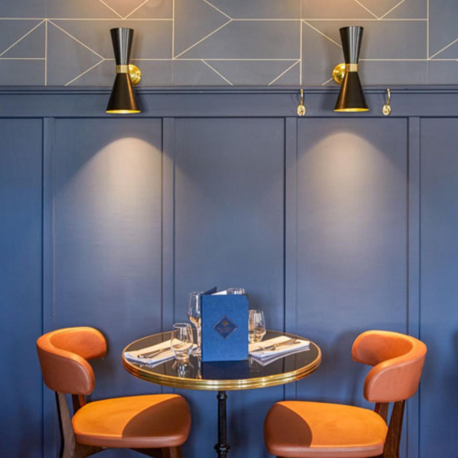 Cairo Double Cone Wall Lamp by Mullan Lighting with dual brass cone shades and sleek wall mounting, perfect for stylish and contemporary interiors