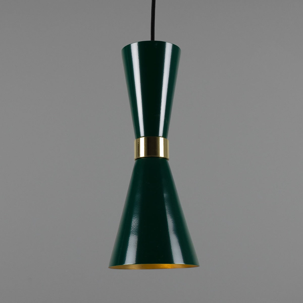 Green pendant lamp with gold accent on a gray background