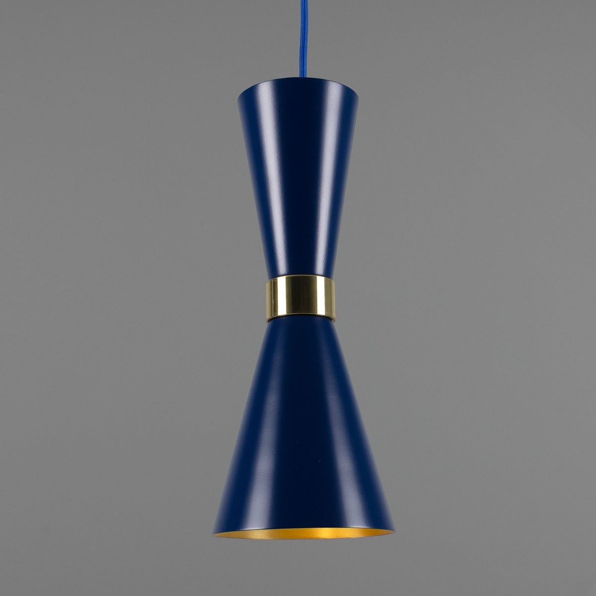 Blue pendant light with gold accent on a gray background