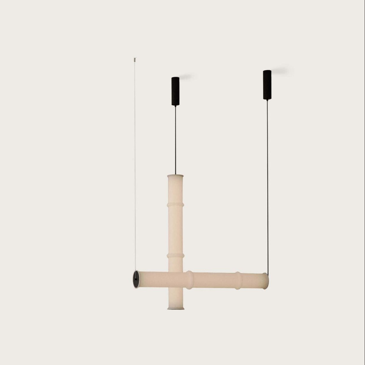 Elegant Canna Pendant Lamp featuring a minimalist tube-shaped form and soft diffused glow, crafted by Aromas del Campo.