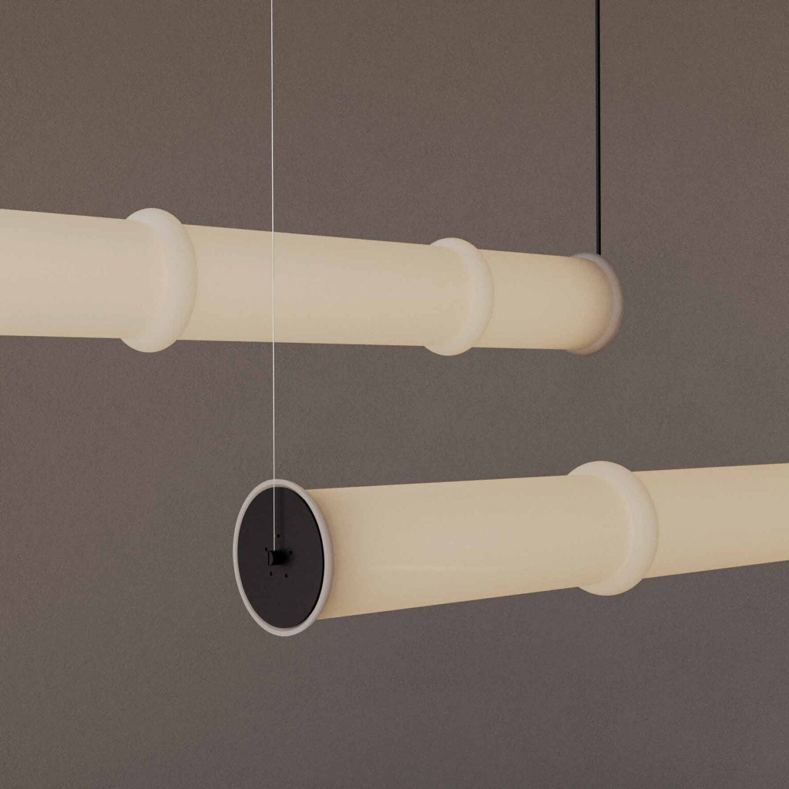 Elegant Canna Pendant Lamp featuring a minimalist tube-shaped form and soft diffused glow, crafted by Aromas del Campo.