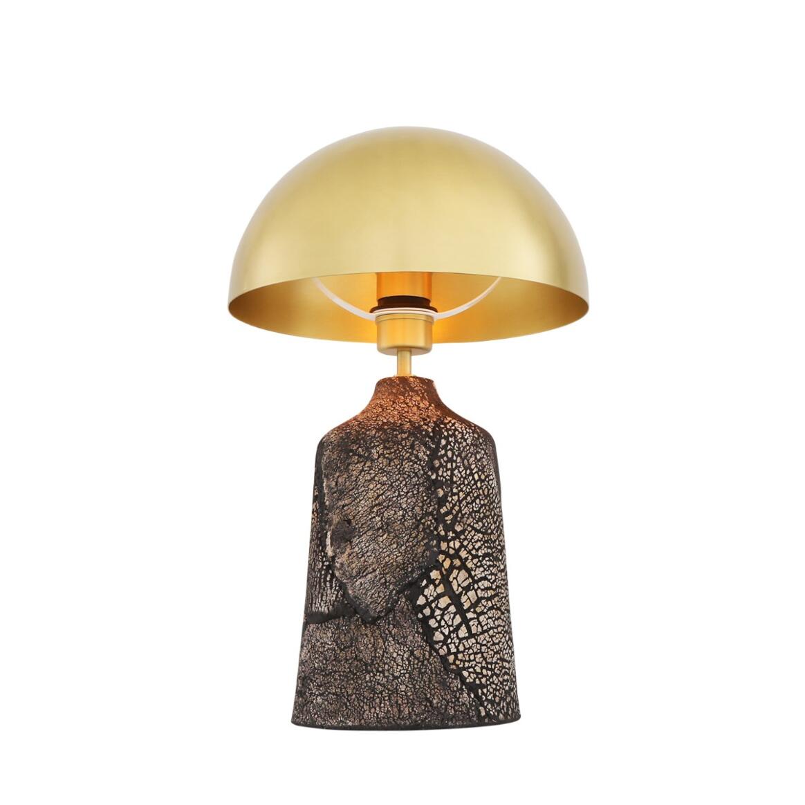 Lamp with gold shade and textured brown base on a white background