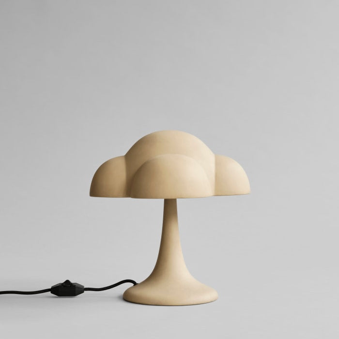 Fungus Table Lamp by 101 Copenhagen with a mushroom-inspired shape and smooth ceramic finish on a minimalist surface