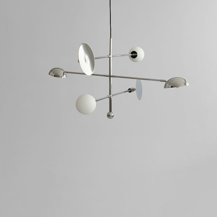 Sahn Chandelier by 101 Copenhagen with minimalist geometric structure and soft lighting, perfect for contemporary interiors.

