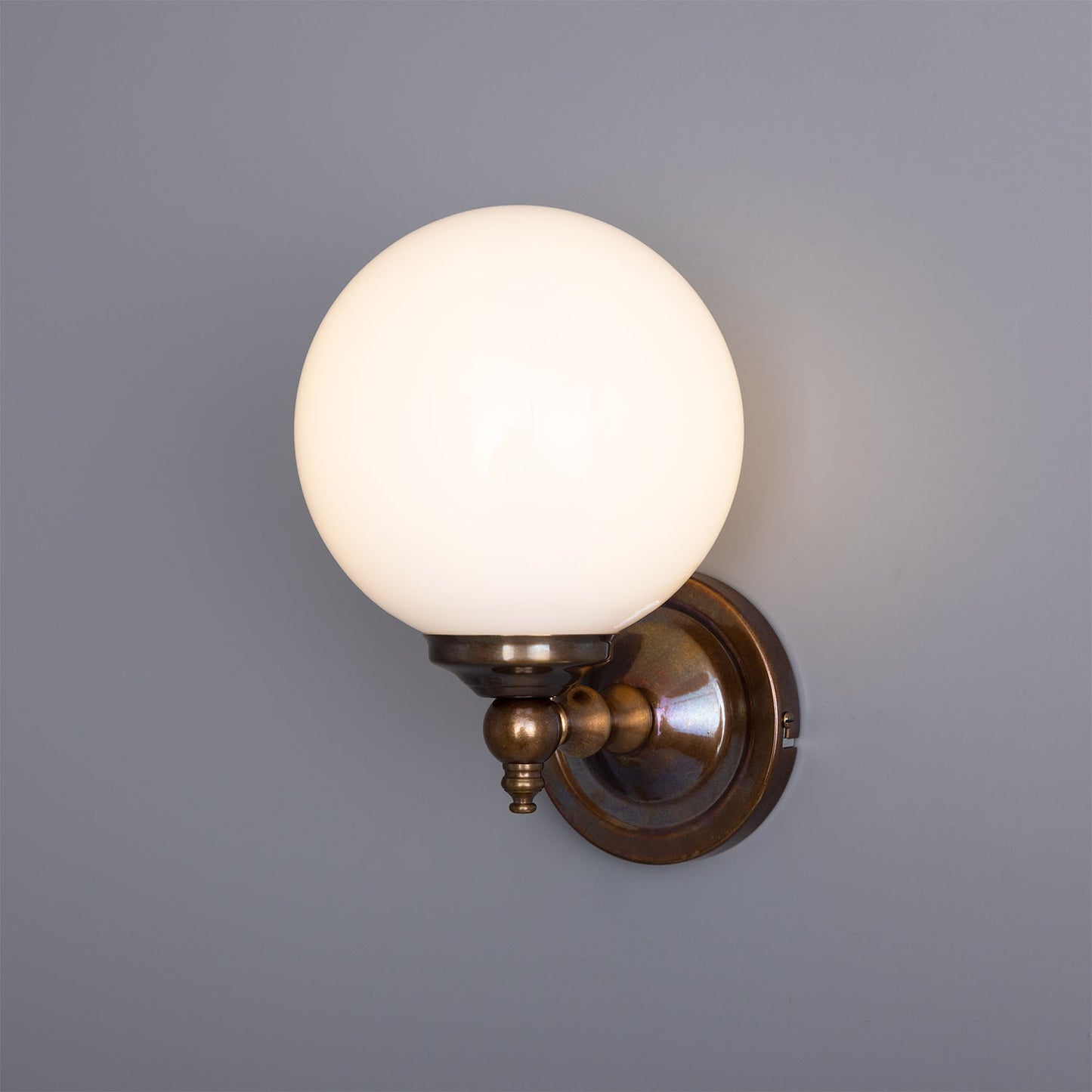 Cloghan Globe Wall Lamp by Mullan Lighting with a sleek globe-shaped shade and elegant wall mount for modern, ambient lighting