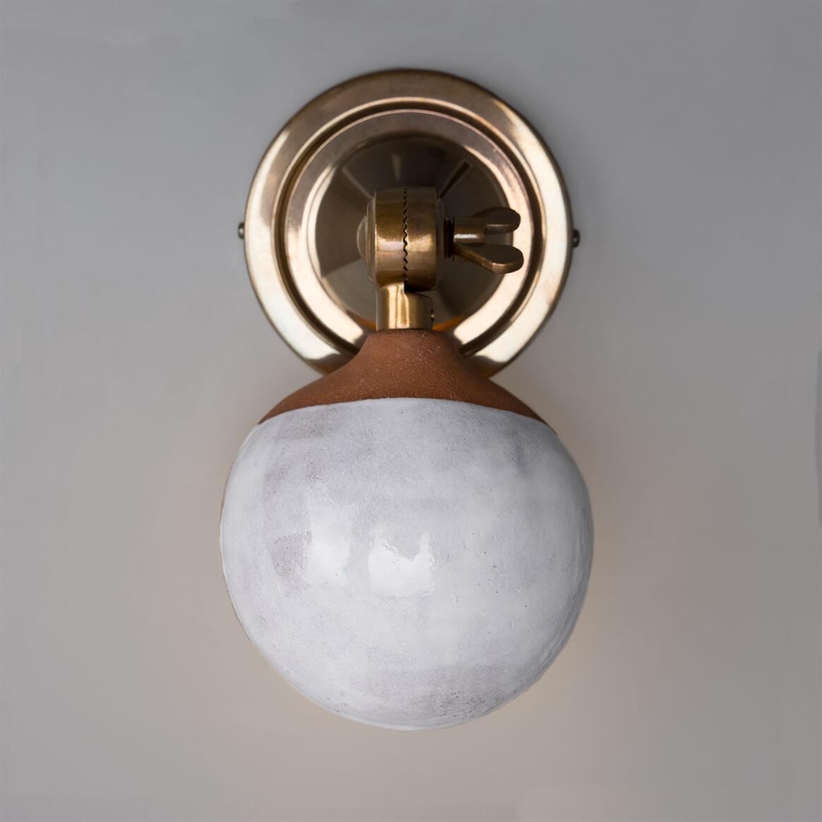 Coco Ceramic Wall Lamp by Mullan Lighting featuring a handcrafted ceramic shade with elegant, modern styling for warm, ambient illumination