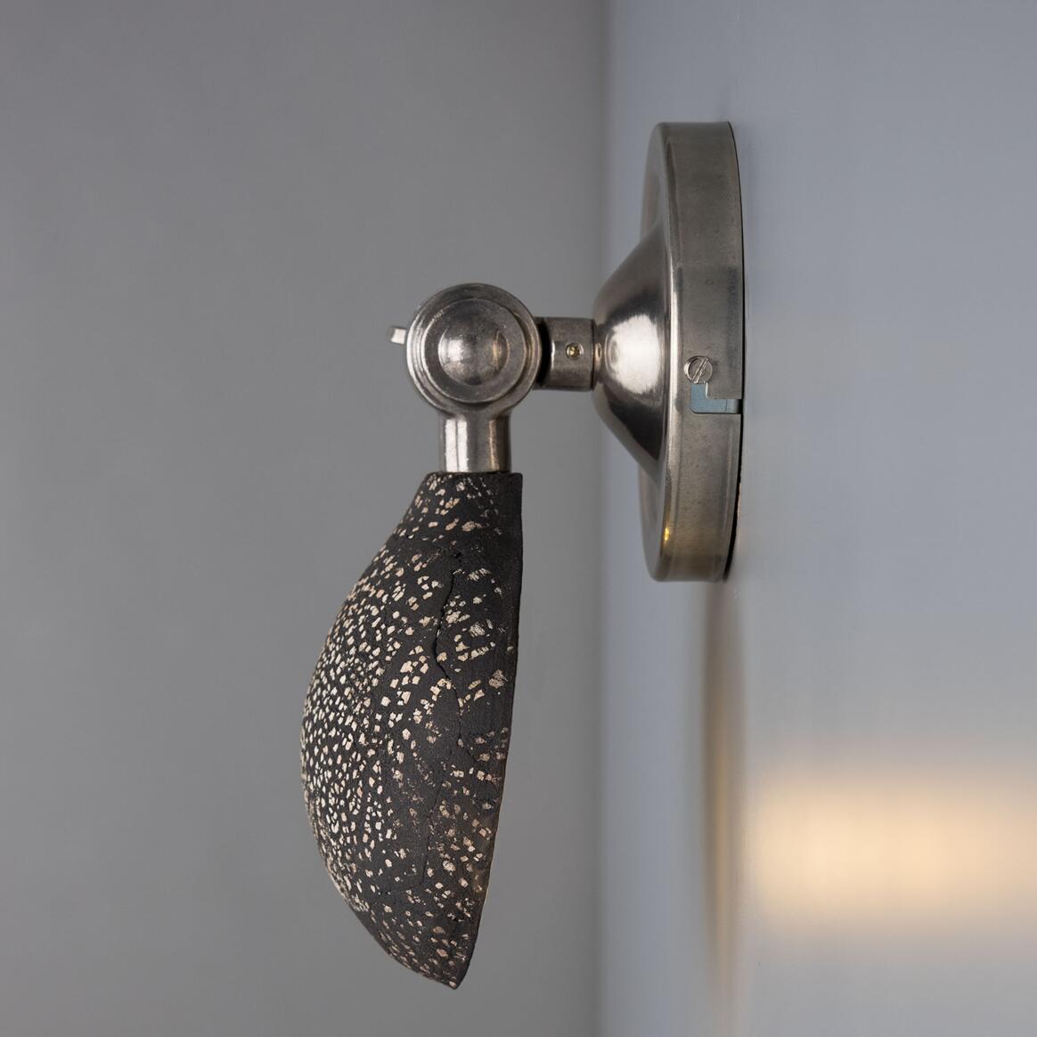 Coco Ceramic Wall Lamp by Mullan Lighting featuring a handcrafted ceramic shade with elegant, modern styling for warm, ambient illumination