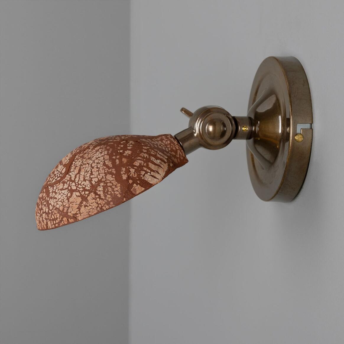 Coco Ceramic Wall Lamp by Mullan Lighting featuring a handcrafted ceramic shade with elegant, modern styling for warm, ambient illumination