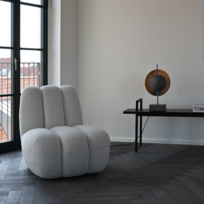 Dusk Table Lamp by 101 Copenhagen featuring a sculptural ceramic base with soft ambient lighting on a modern console table.