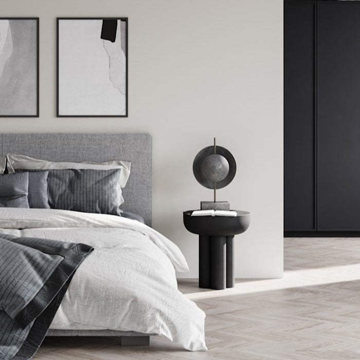 Dusk Table Lamp by 101 Copenhagen featuring a sculptural ceramic base with soft ambient lighting on a modern console table.