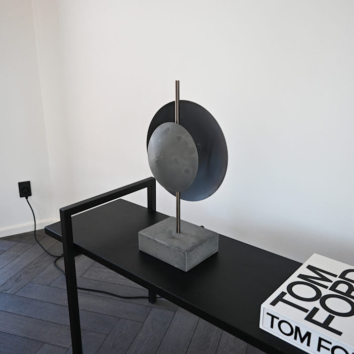 Dusk Table Lamp by 101 Copenhagen featuring a sculptural ceramic base with soft ambient lighting on a modern console table.