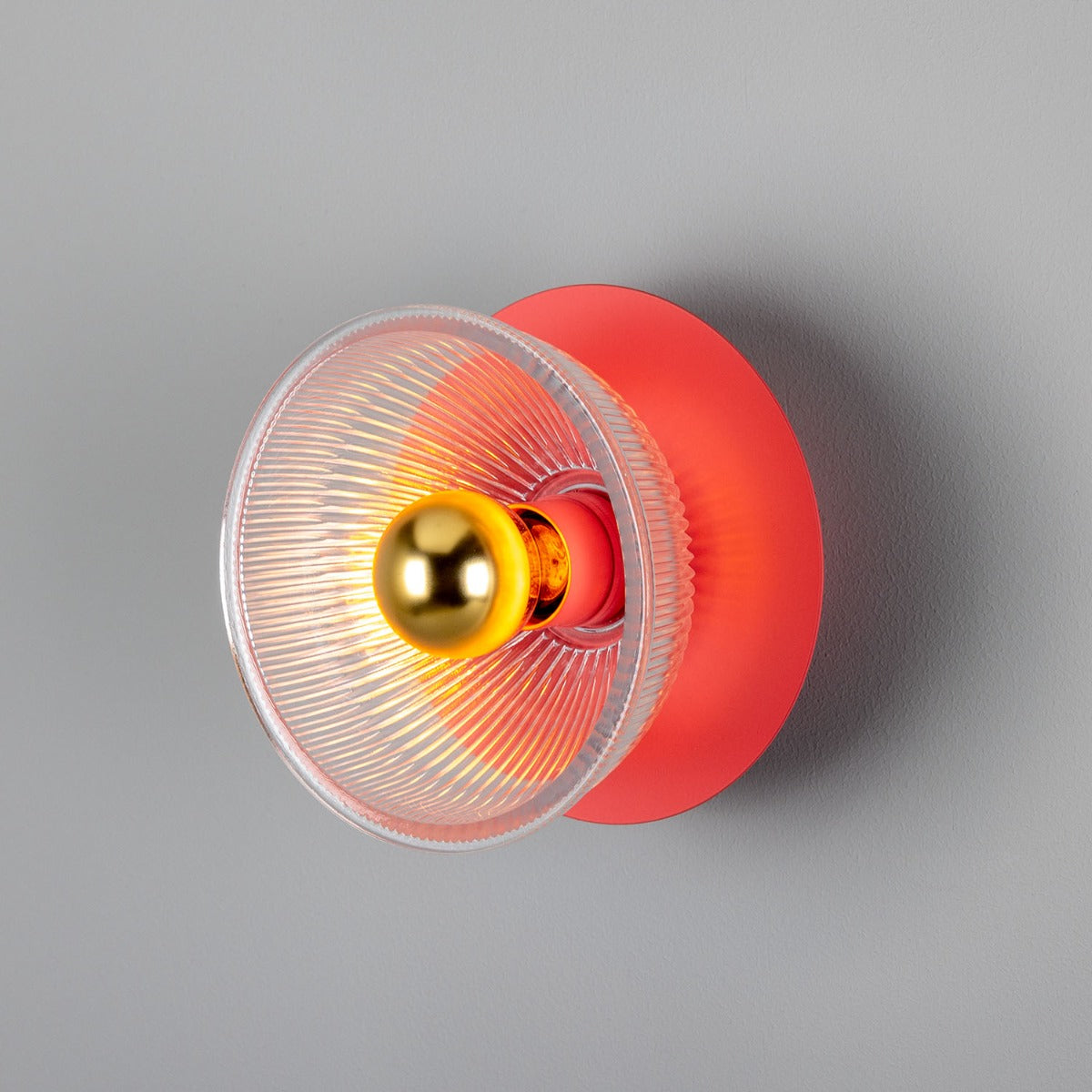 Red yoyo with a gold bearing on a gray background