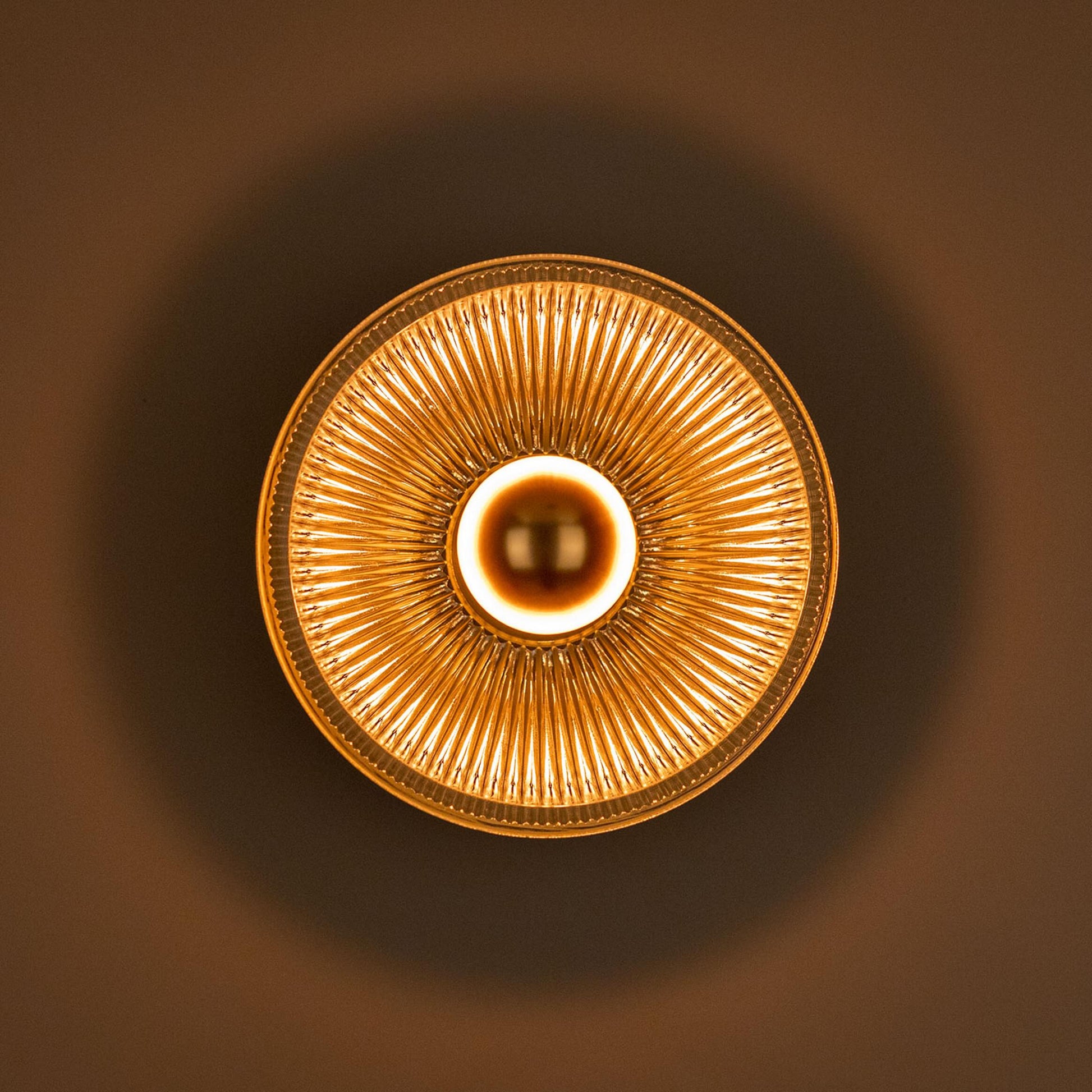 Eclipse Dish Wall Lamp by Mullan Lighting featuring a striking dish-shaped design that creates a dramatic, ambient wall lighting effect