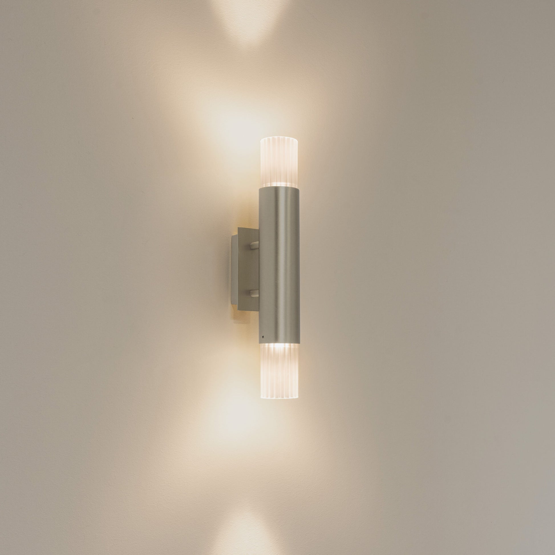 Embrace wall lamp by Ilfari, modern European designer wall lighting with sculptural luxury design for premium interiors