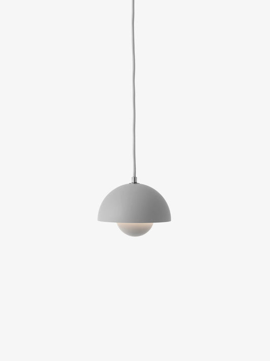 The Flowerpot VP10 lamp by &Tradition in a colorful finish, adding a fun accent to the room.

