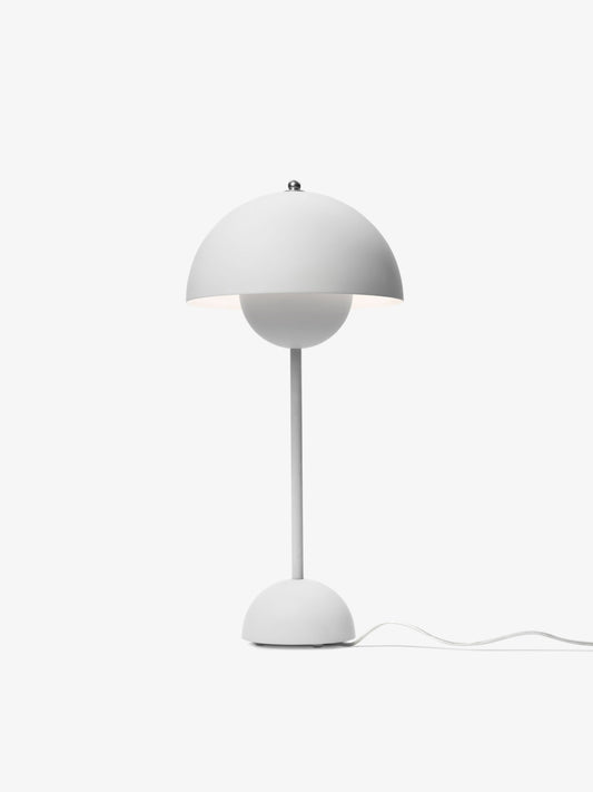 Flowerpot VP3 Table Lamp by &Tradition in matte white finish on a wooden desk

