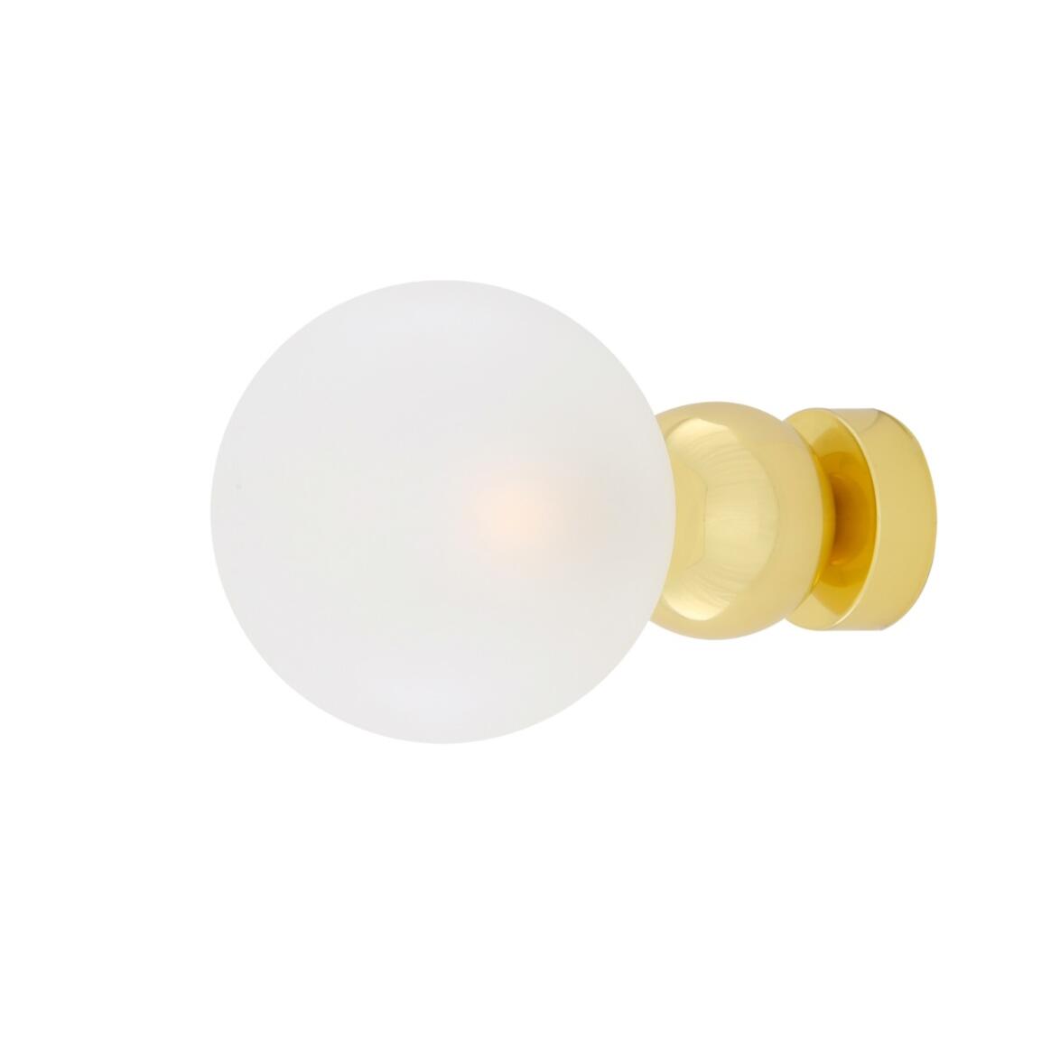 White spherical knob with gold base on a white background