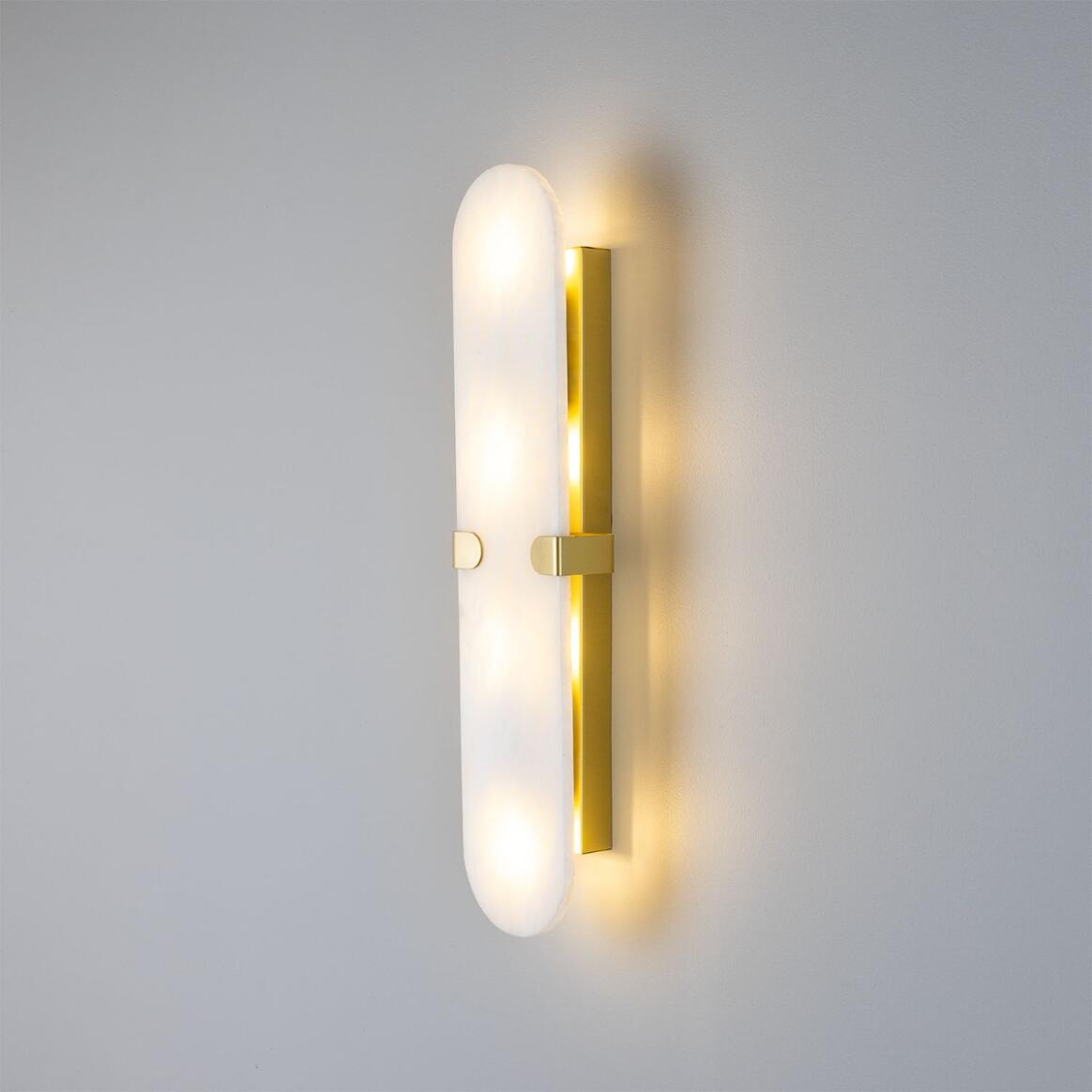 Lothian Oval Alabaster Wall Lamp by Mullan Lighting with a smooth oval alabaster shade offering soft, diffused light for elegant interior spaces.