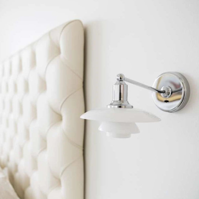 White & chrome wall light by Louis Poulsen  in India