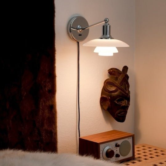 White & chrome wall light by Louis Poulsen  in India