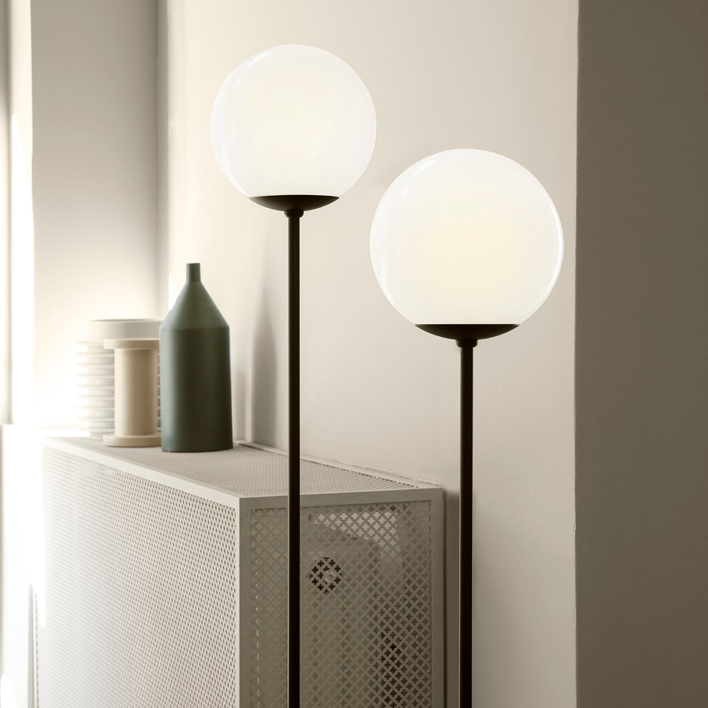 Astep Model 1081 Floor Lamp featuring a spherical opaline glass diffuser on a slim metal stand, delivering soft ambient light with mid-century elegance.