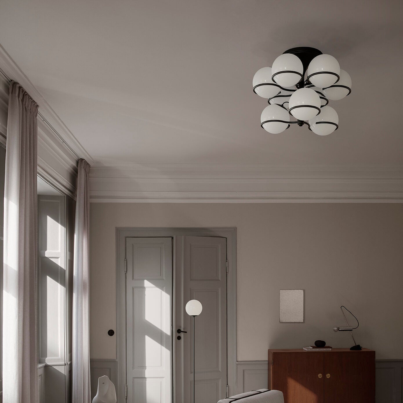 Astep Model 2042/9 Ceiling Lamp featuring nine opaline glass spheres on a refined brass frame, delivering soft illumination with timeless elegance.