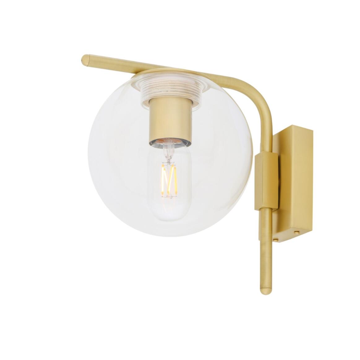 Wall-mounted light fixture with gold finish and clear glass shade on a white background