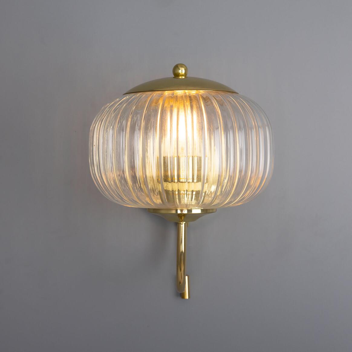 Nehir Wall Lamp by Mullan Lighting with a sleek, modern design and warm ambient illumination, ideal for contemporary and timeless interiors
