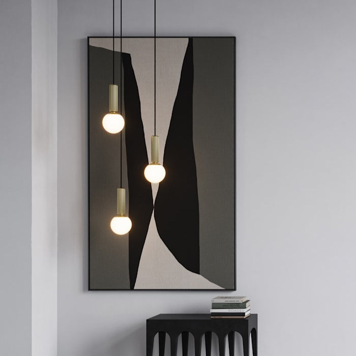 No. 2 Pendant Lamp by 101 Copenhagen suspended from the ceiling, showcasing its curved sculptural design in a modern interior.