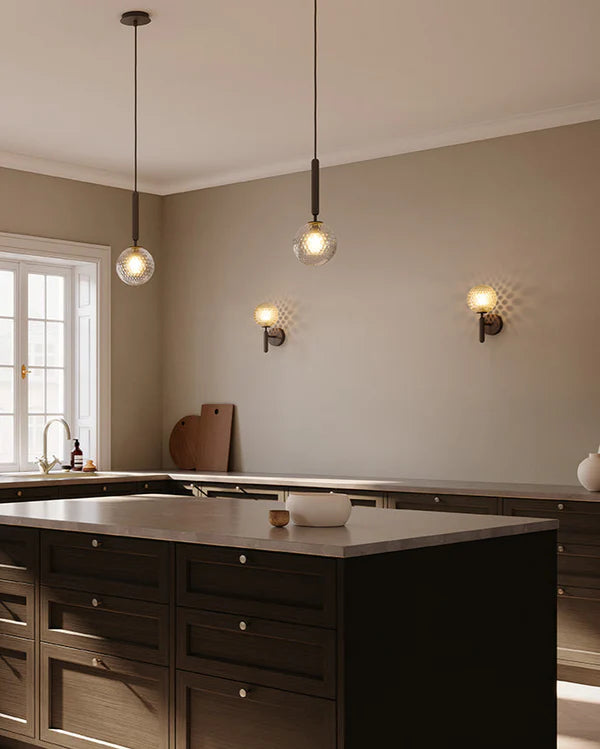 Nuura Miira 1 Pendant Light with brass body and clear patterened glass shade, perfect for elegant, modern lighting. Shop now at My Design Angel.