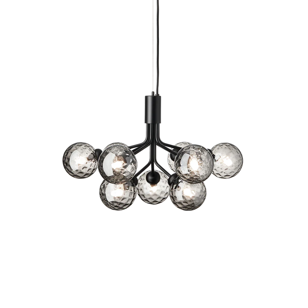 Nuura Apiales 9 chandelier with satin black arms and nine smoked glass shades, designed for modern interiors with elegant, ambient lighting.







