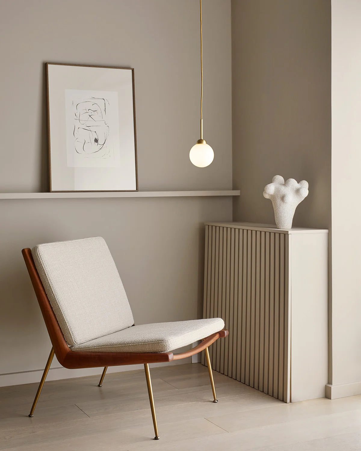 Modern pendant light with minimalist design, showcasing opal glass and gold accents, ideal for ambient and task lighting.