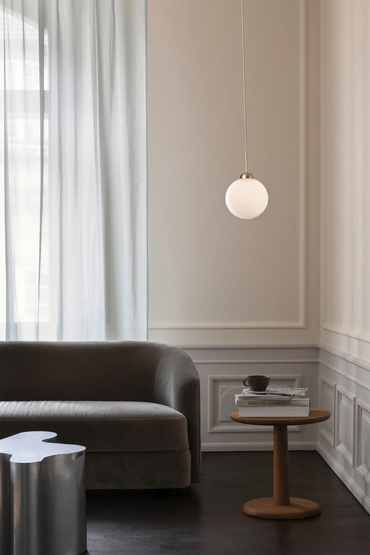 Elegant and compact, the Apiales 1 pendant lamp by Nuura features opal glass and brass details—perfect for cozy corners or stylish kitchen lighting.








