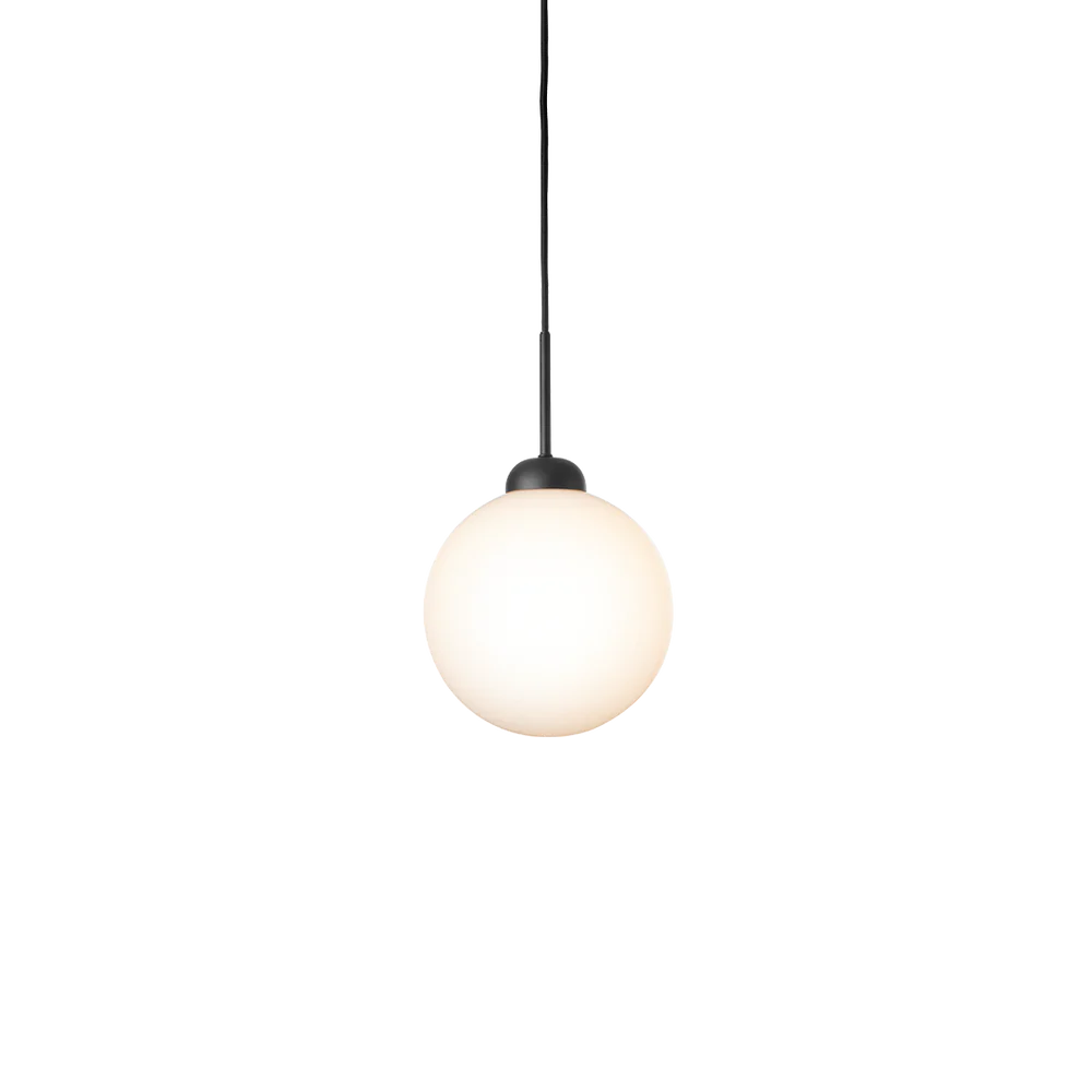 Close-up of Nuura Apiales 1 pendant lamp featuring a hand-blown opal glass shade and elegant brushed brass finish.