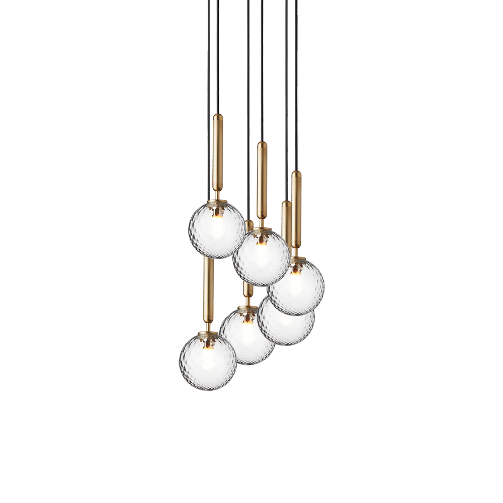 Miira 6 Chandelier by Nuura in brass and clear glass is Scandinavian light for dining lights, living room lights in house interior lights as contemporary lights for home decor