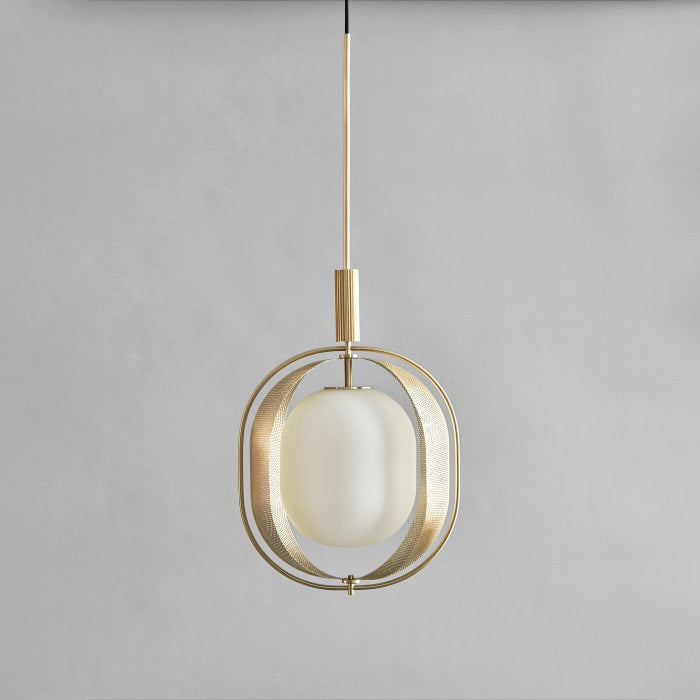 Pearl Pendant Lamp by 101 Copenhagen hanging from the ceiling with multiple opal glass globes and a brass structure.