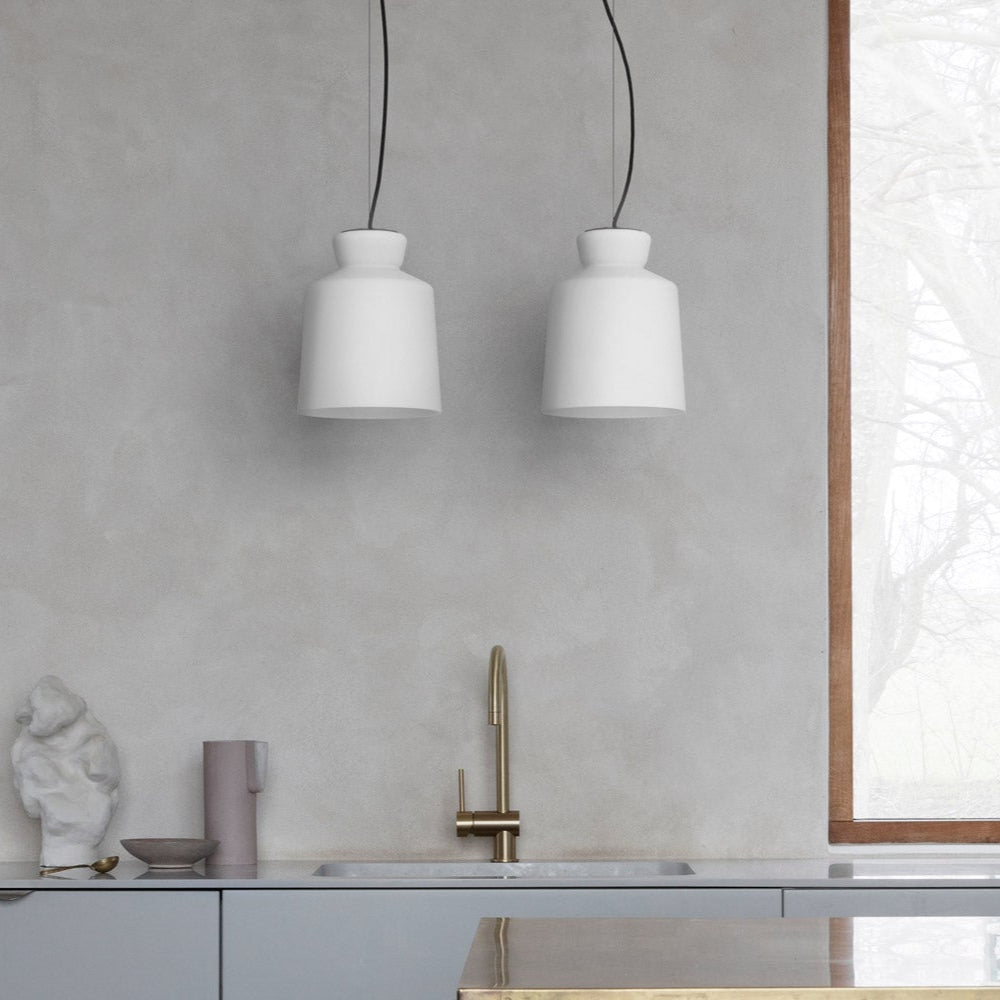 Astep SB Cinquantotto Suspension Lamp with a minimalist opaline glass sphere and sleek metal detailing, delivering soft, diffused ambient light.
