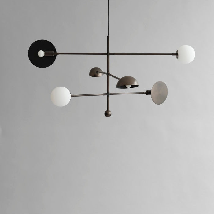 Sahn Chandelier by 101 Copenhagen with minimalist geometric structure and soft lighting, perfect for contemporary interiors.

