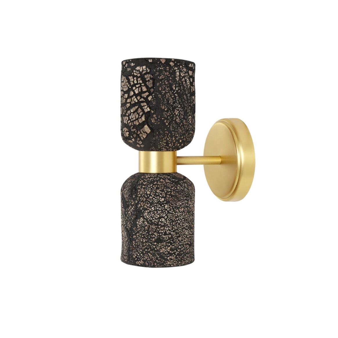 Wall-mounted light fixture with black textured design and gold accents on a white background