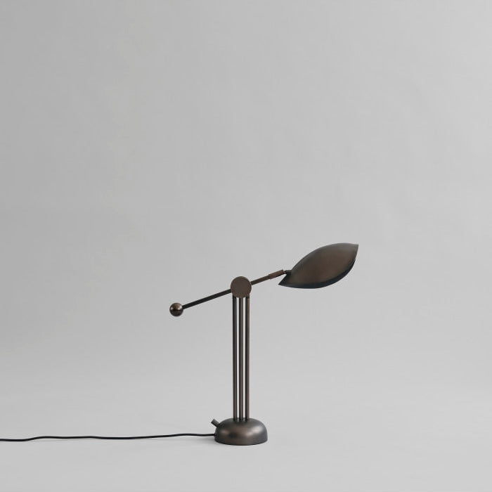 Stingray Table Lamp by 101 Copenhagen featuring curved, organic shapes and a matte finish, ideal for stylish modern desks and tables.

