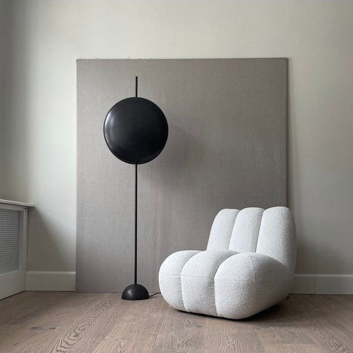 Totem Floor Lamp by 101 Copenhagen with a sculptural stacked design and warm light in a minimalist living room
