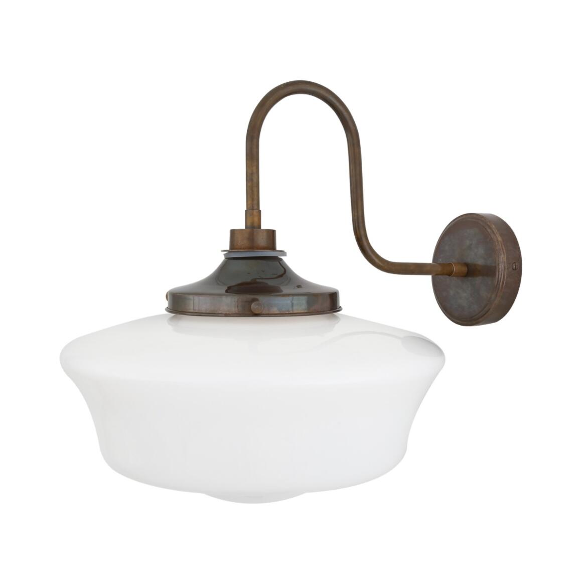 Vintage-style wall-mounted light fixture with white glass shade and bronze metal arm on a white background