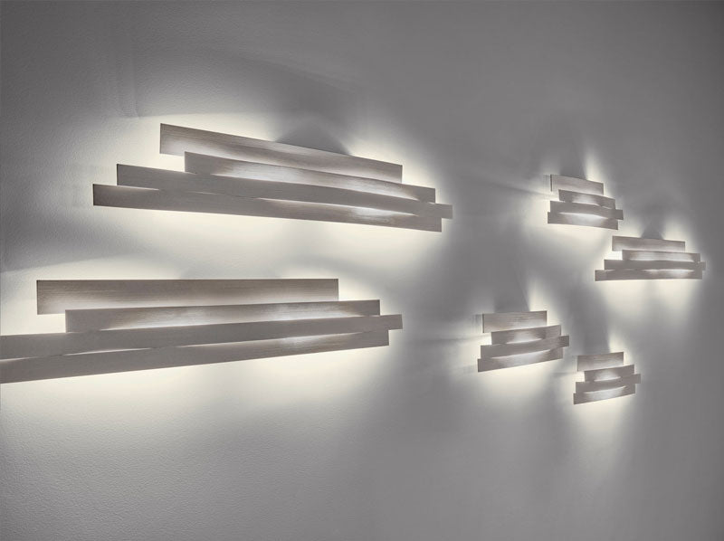Discover the Li Wall Lamp—an elegant minimalist lighting design that provides soft ambient illumination for contemporary interiors.